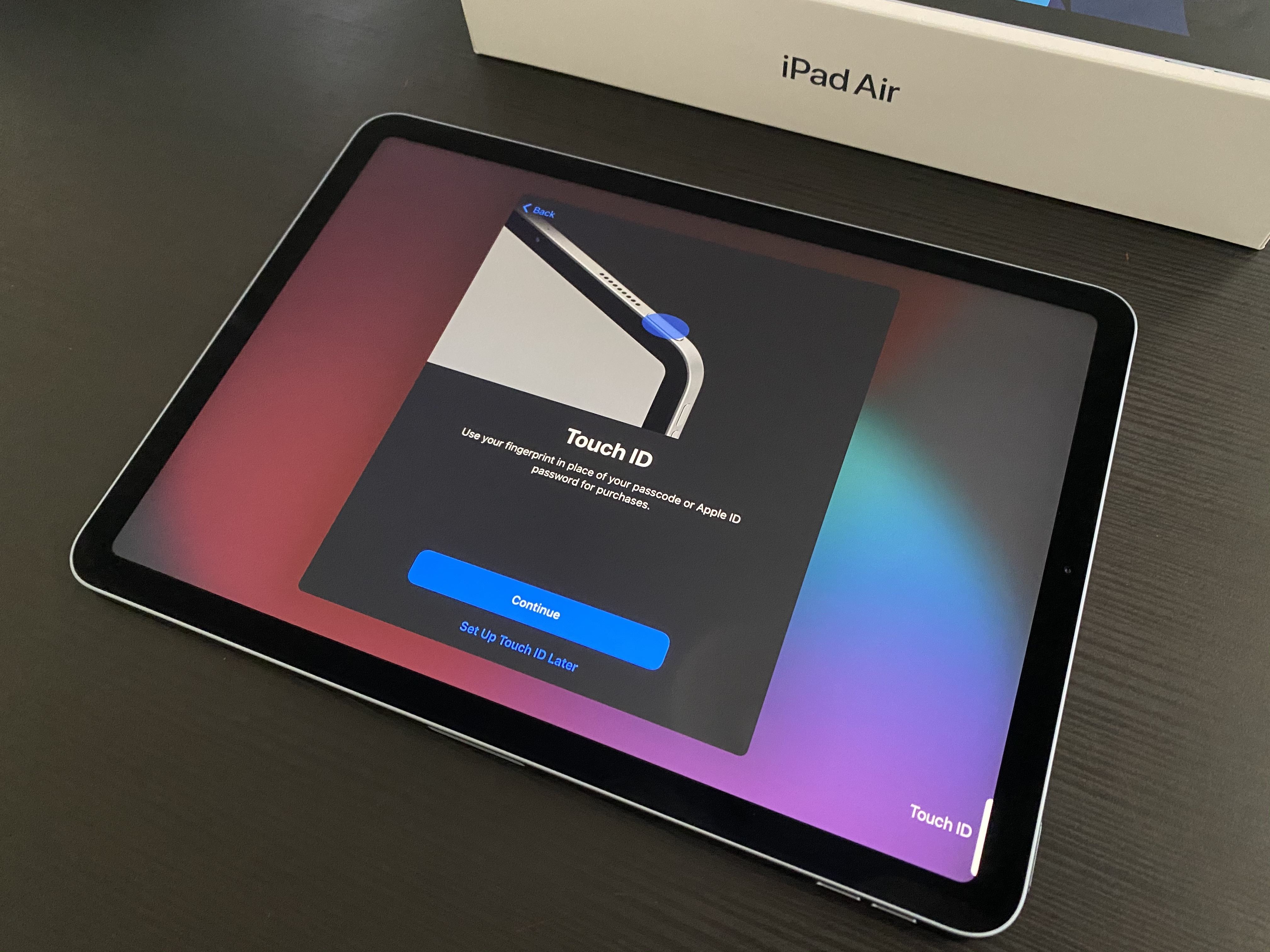Setting up Touch ID on iPad Air.