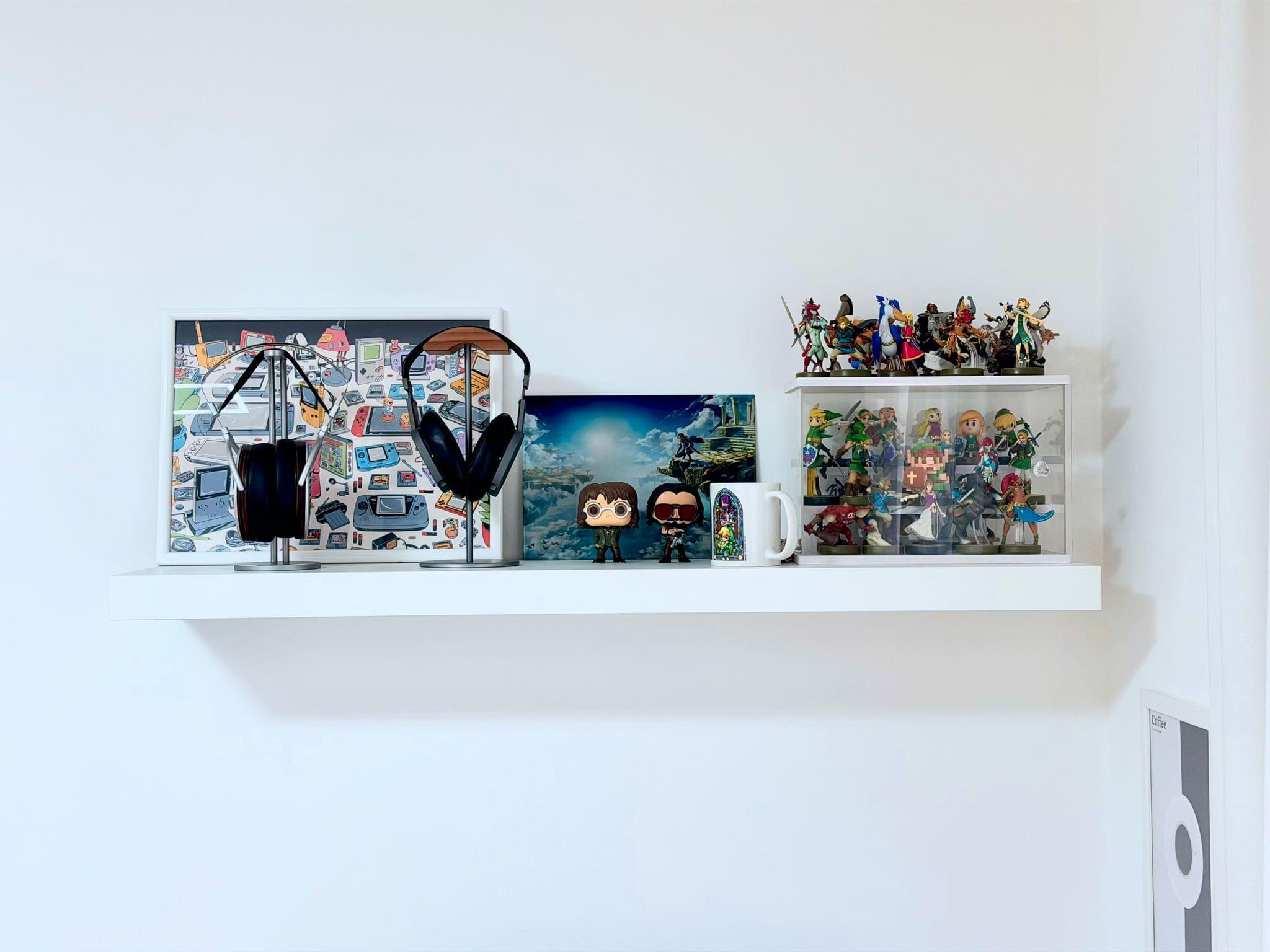 The shelf above my desk featuring my favorite headphones and my Zelda amiibo collection.