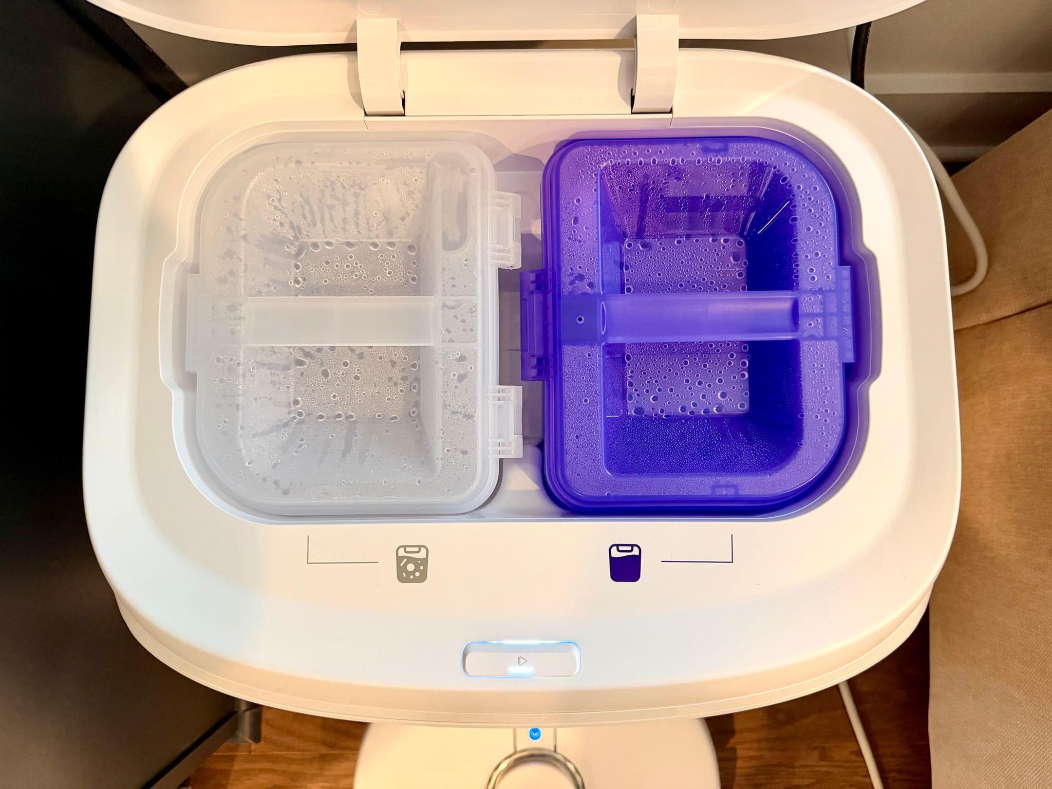 The Narwal's clean and dirty water tanks.