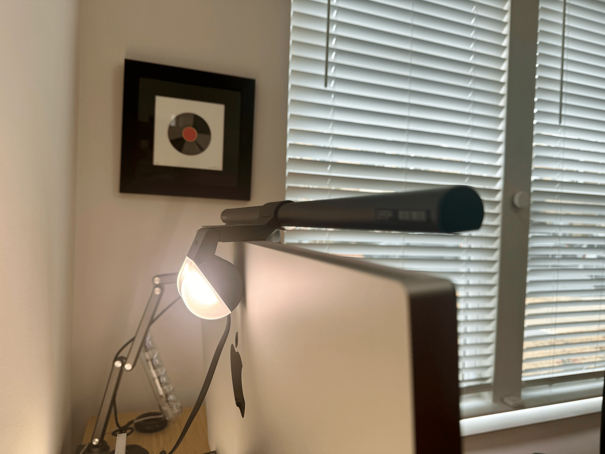 The ScreenBar Halo lights my desk and provides backlighting to the Studio Display.