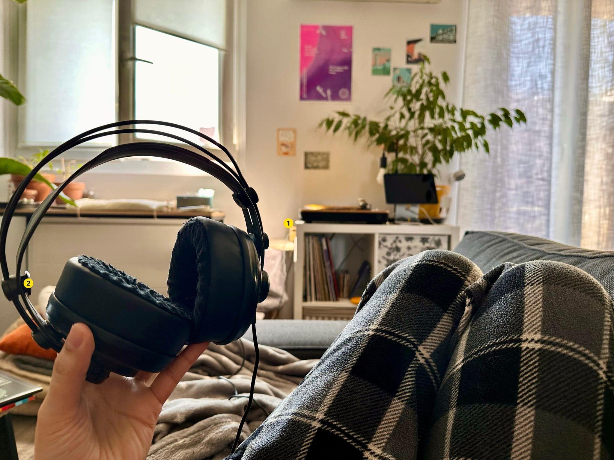 About to enjoy a vinyl record for the first time from the couch (*reenactment*). The headphones' (2) cable is long enough to reach all the way down to the headphone amplifier (1).